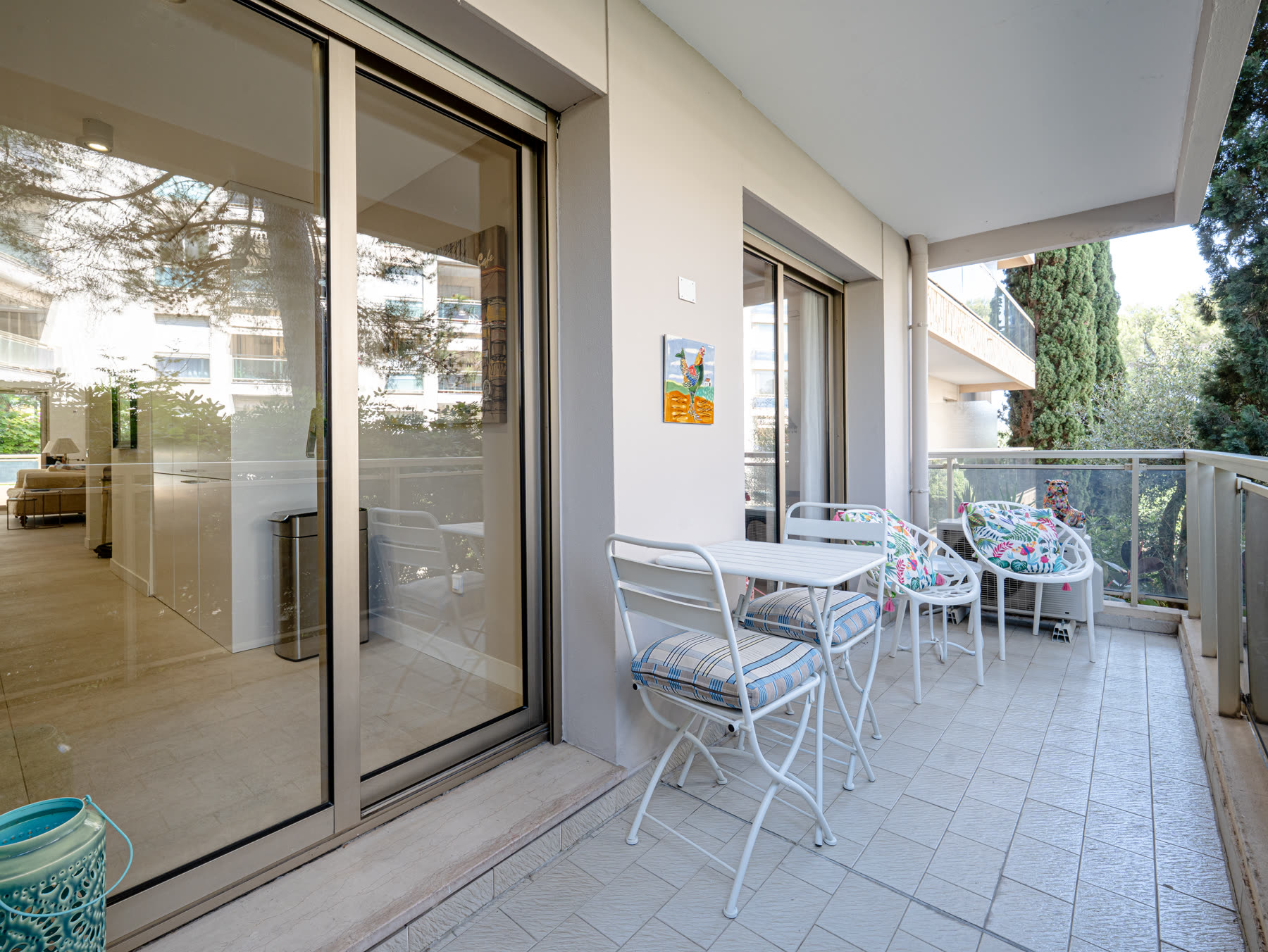 Second terrace with bistro table and garden views
