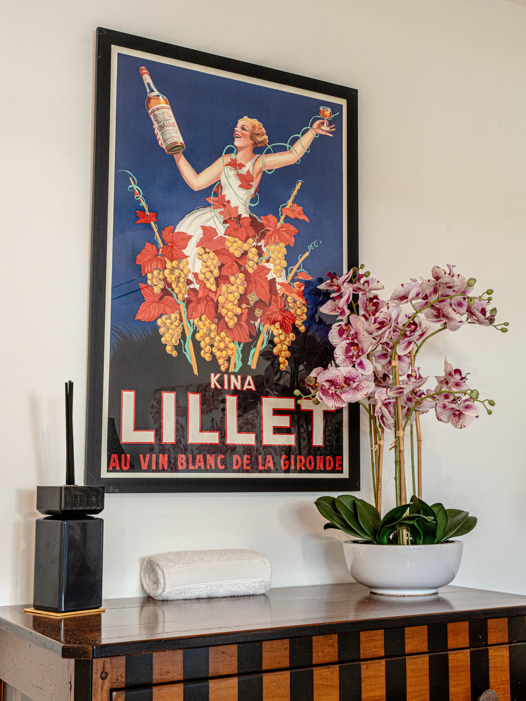 Vintage Lillet poster above an orchid
